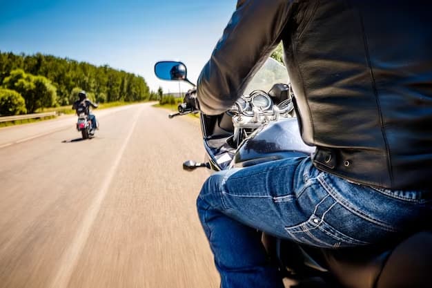 A man is riding a motorcycle